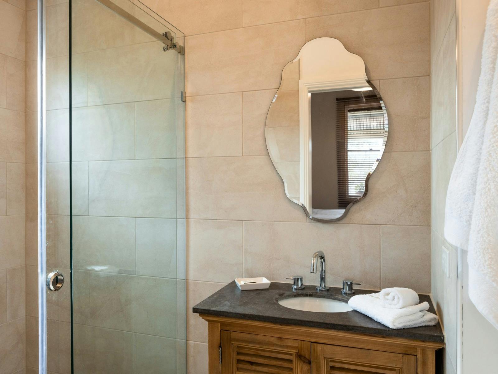 This bathroom enters from the queen bedroom.