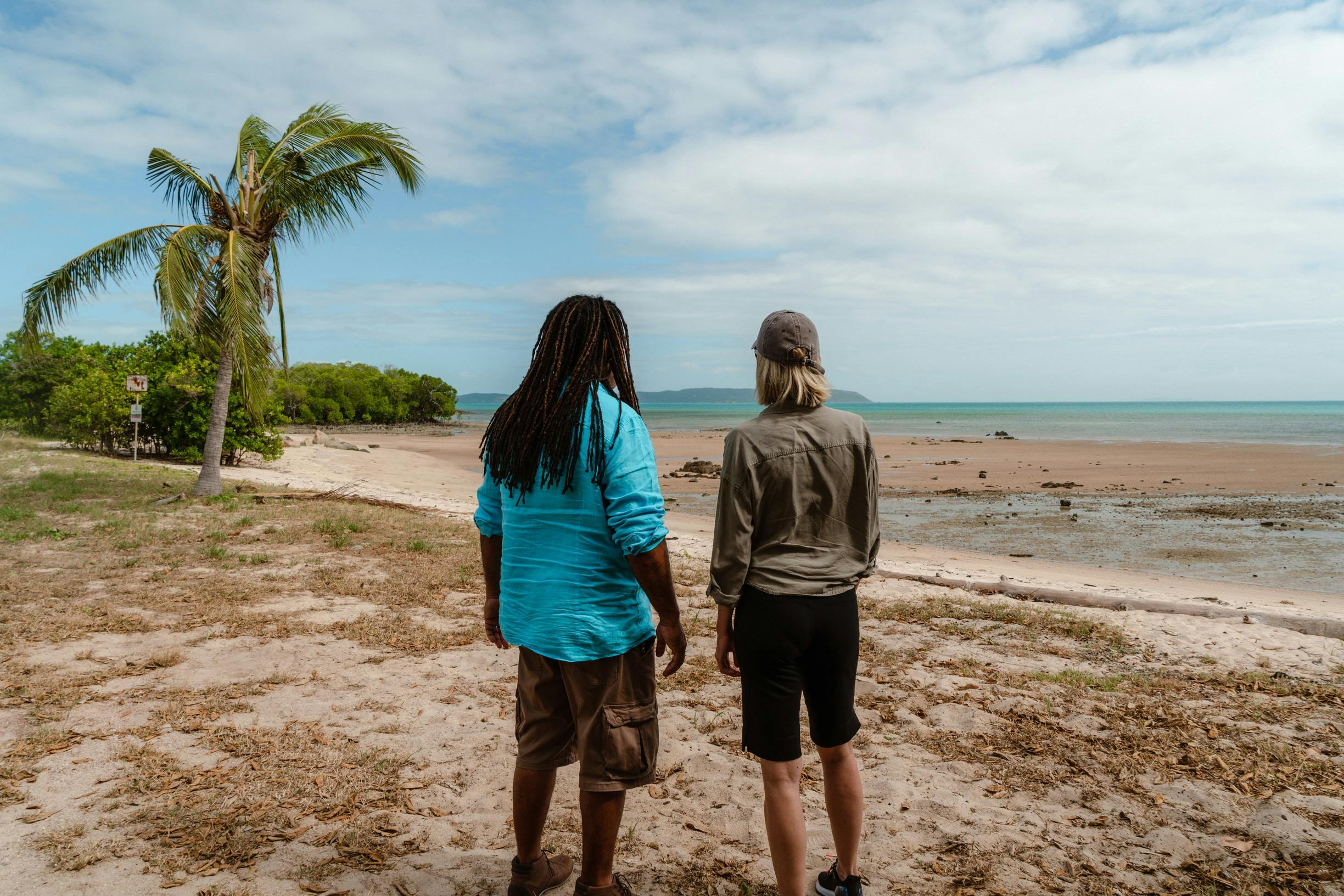 Visitor with a local guide exploring historical displays and heritage sites on Horn Island, Torres S