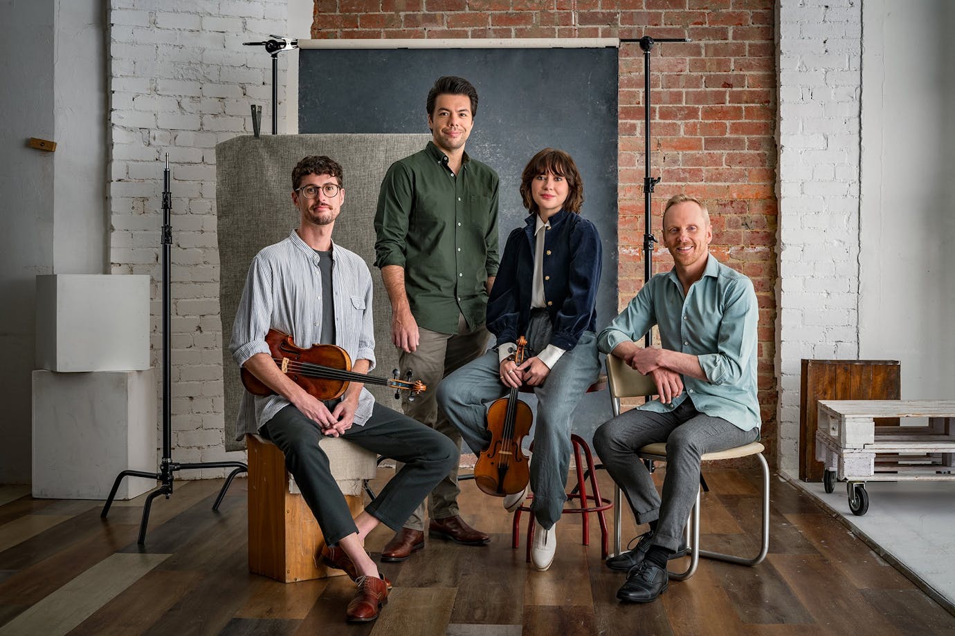 four musicians with their instruments