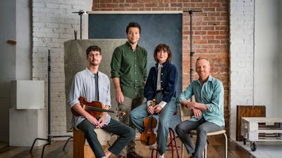 four musicians with their instruments