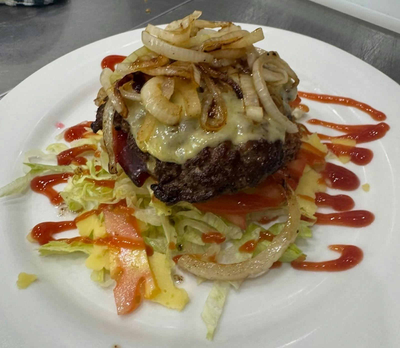 Bunless Burger with salad beef patty onion and sauce e at Vode Cafe