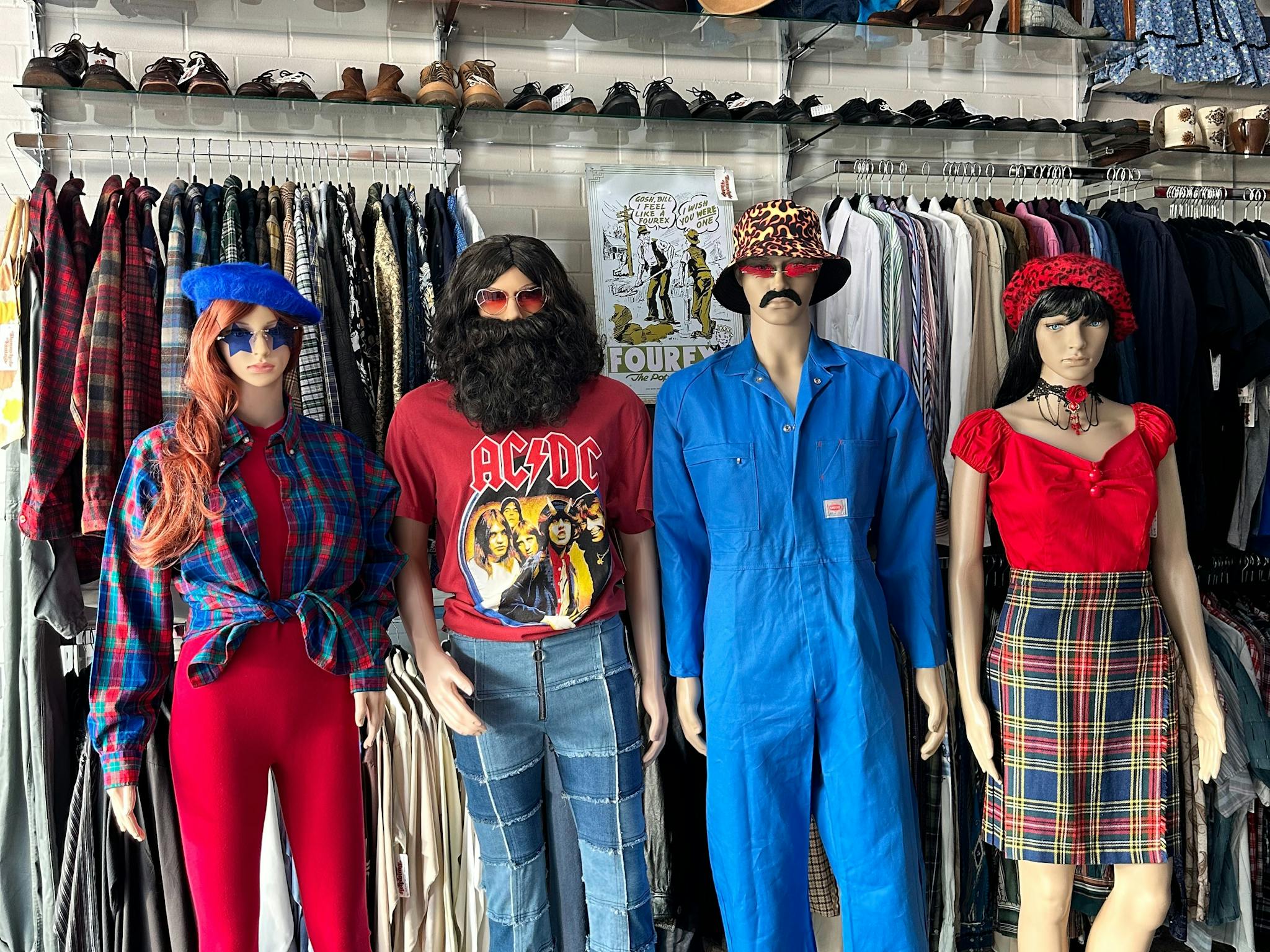Four mannequins wearing vintage style clothing