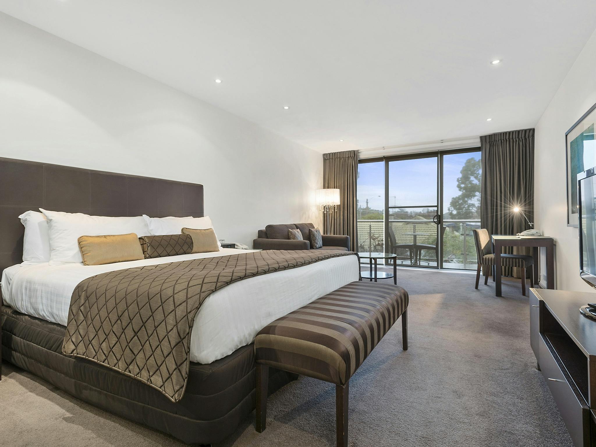 The Gateway's King Suites offer views of treetops from your private balcony