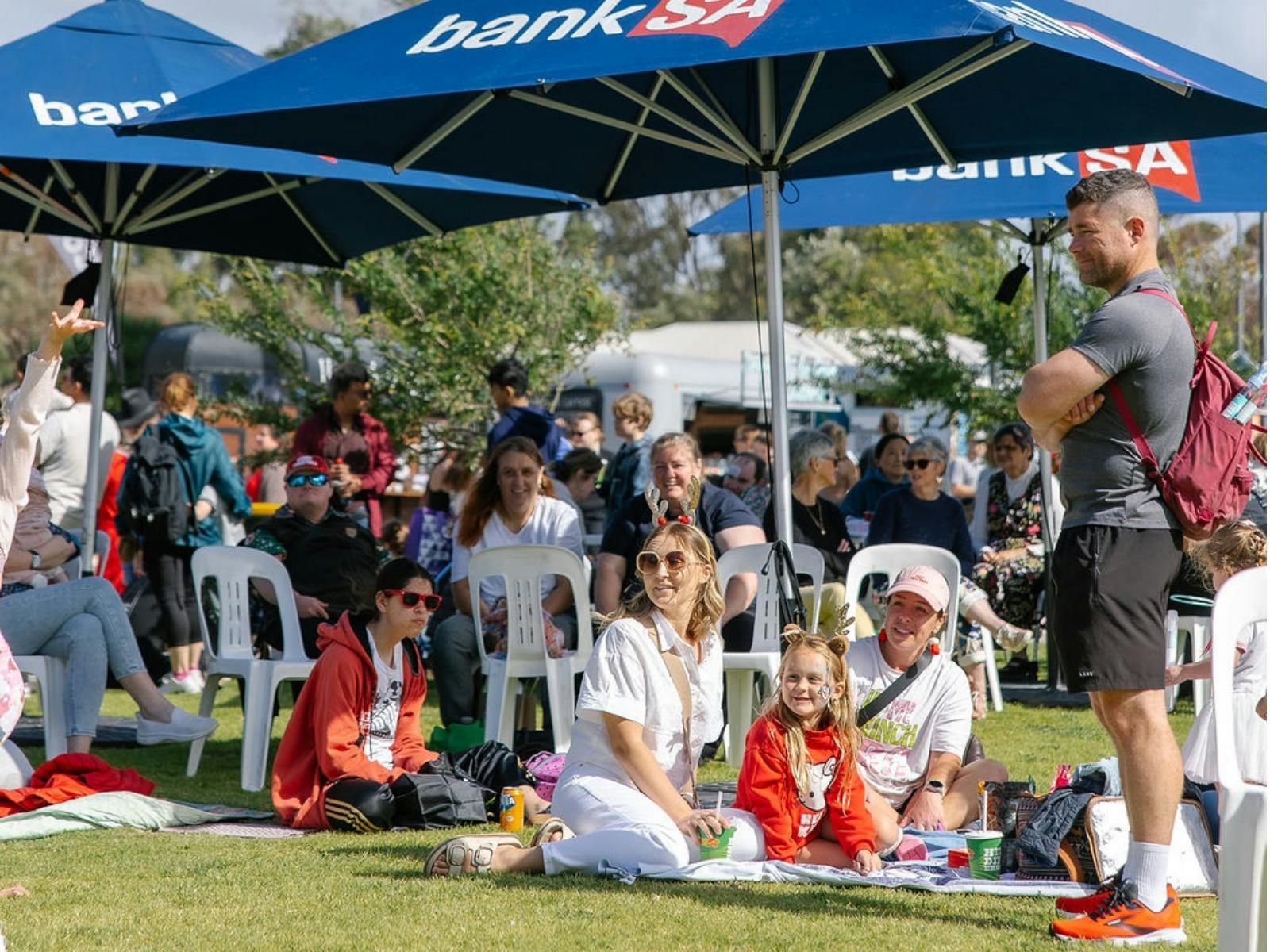 Visitors enjoying the performances on the lawns