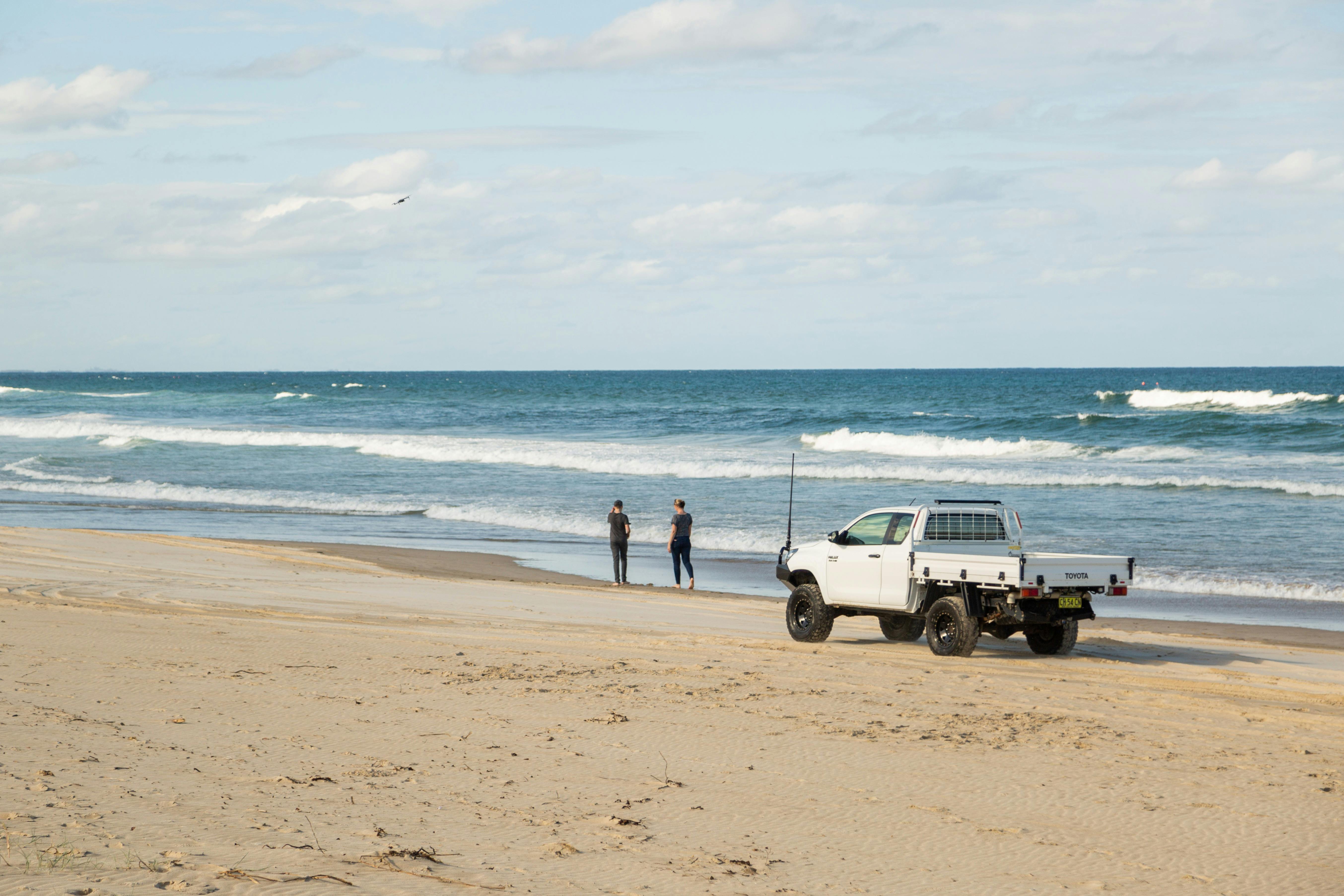 Ute and people on beach