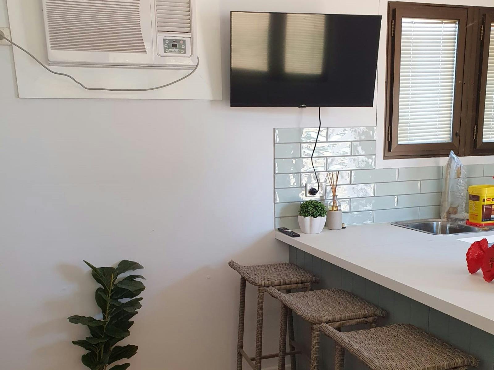 Bar stools at kitchen bed in the Merino Cabin, Charlotte Plains, Outback Queensland