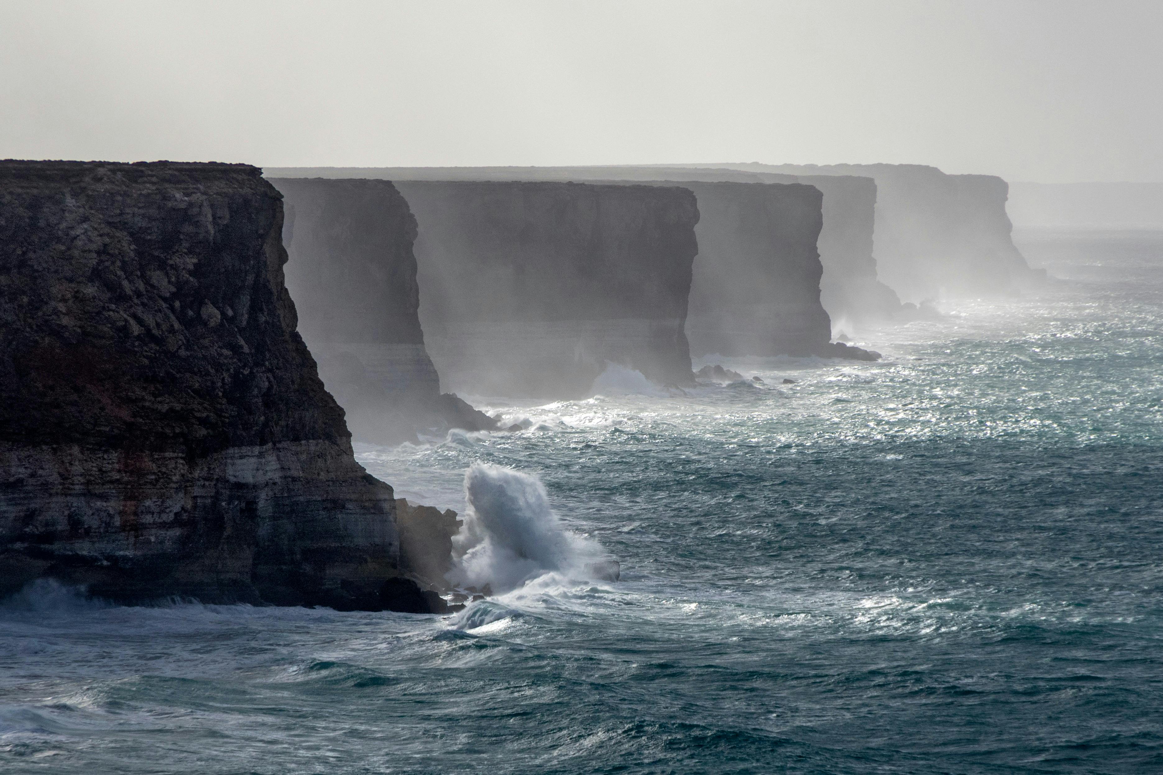 cliffs dropping into the sea and stretching into the distance