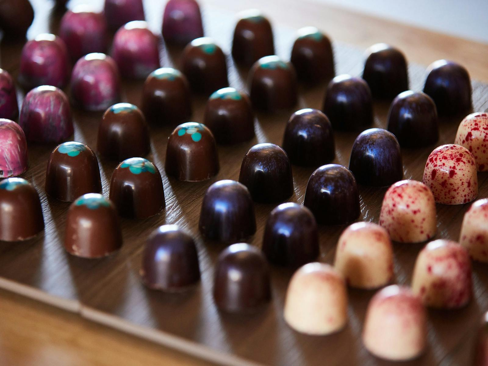 A tray of colourful chocolates