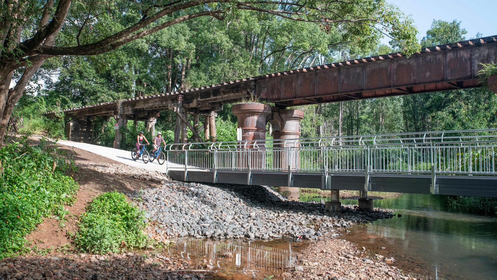 Riding past the upper Burringbar rail bridge on the Northern Rivers Rail Trail with Better By Bike