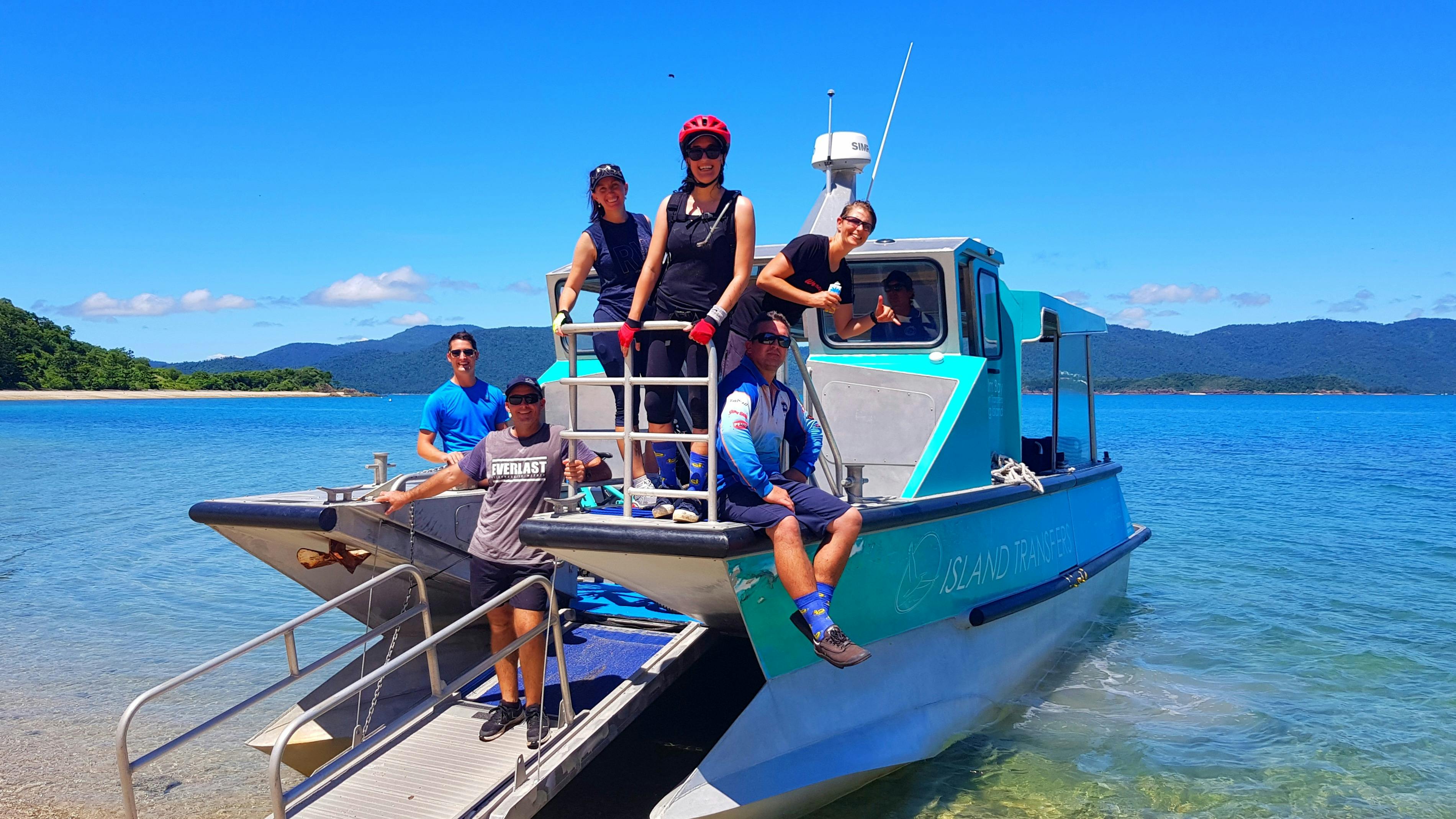 The boat transfer to and from the bike trails of South Molle Island is all part of the adventure.