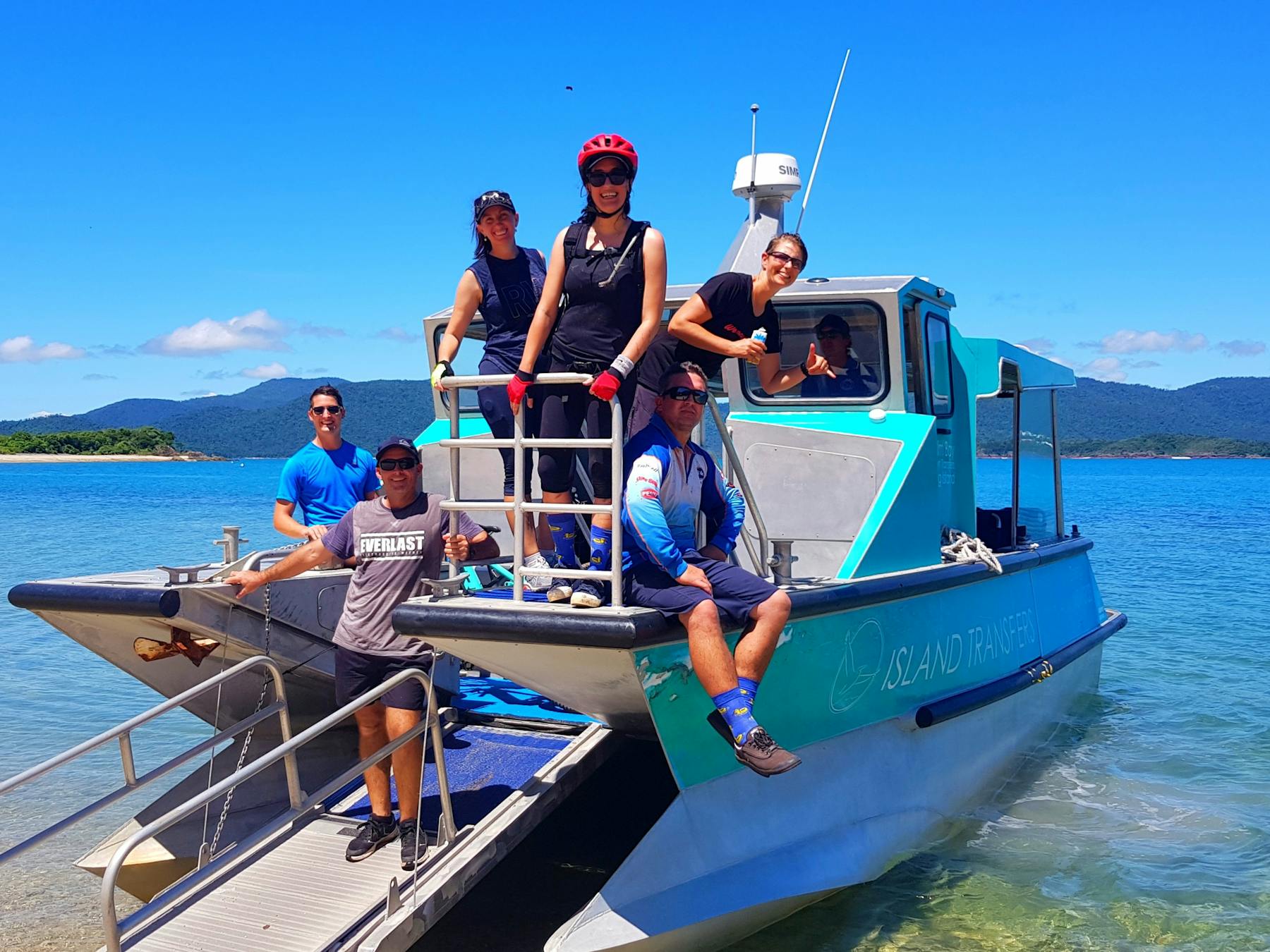The boat transfer to and from the bike trails of South Molle Island is all part of the adventure.