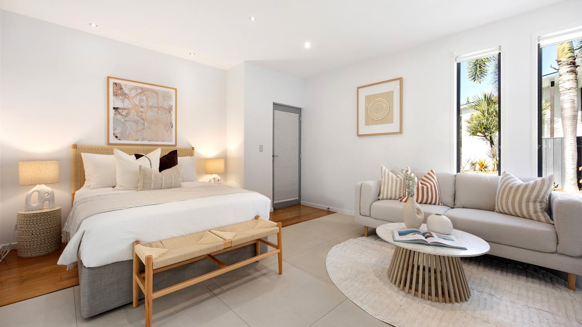 Downstairs bedroom with queen bed. This room can be accessed from the side or at the front at the ma