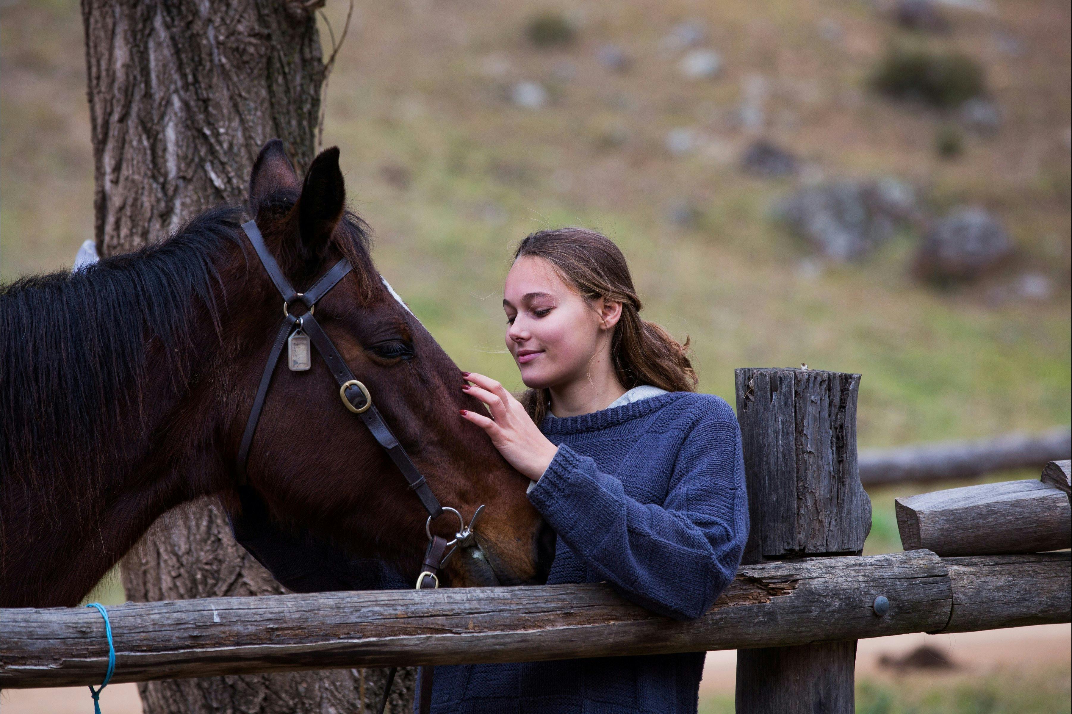 Teenage girl with horse