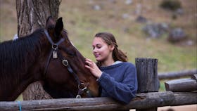 Teenage girl with horse