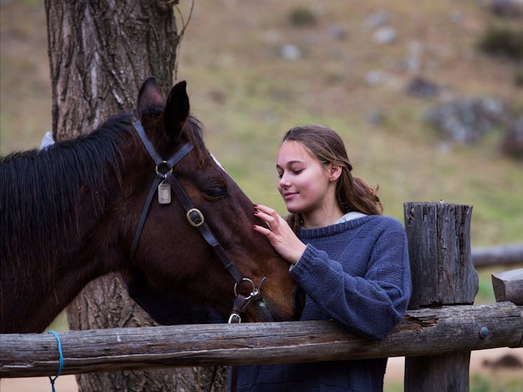 Teenage girl with horse