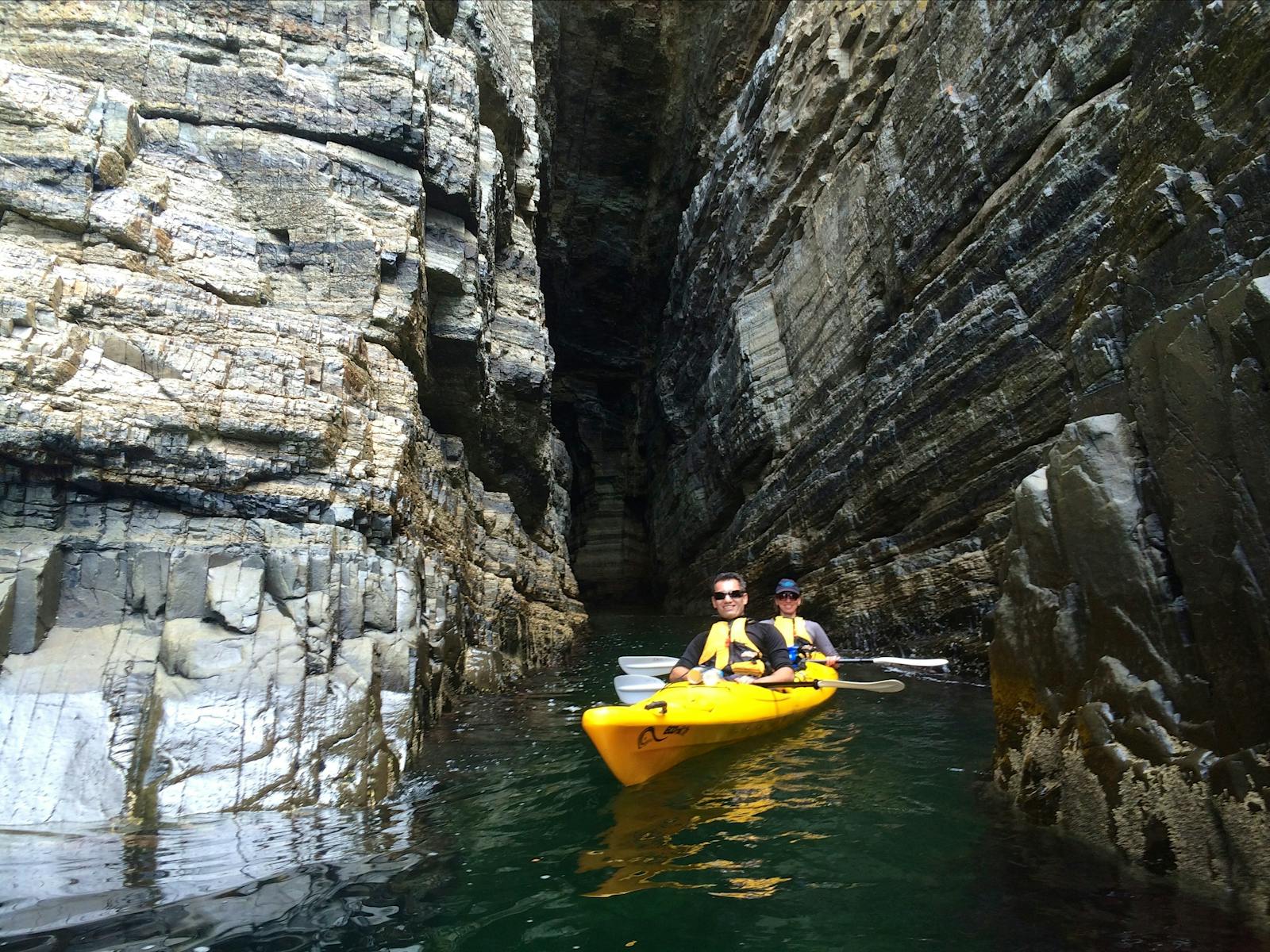 Kayakers in a cave, Derwent River, Hobart