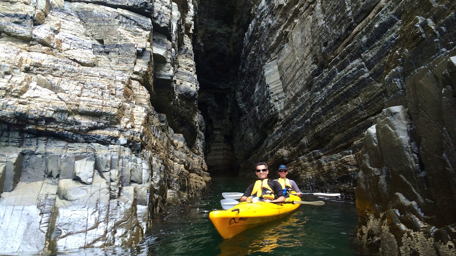Kayakers in a cave, Derwent River, Hobart