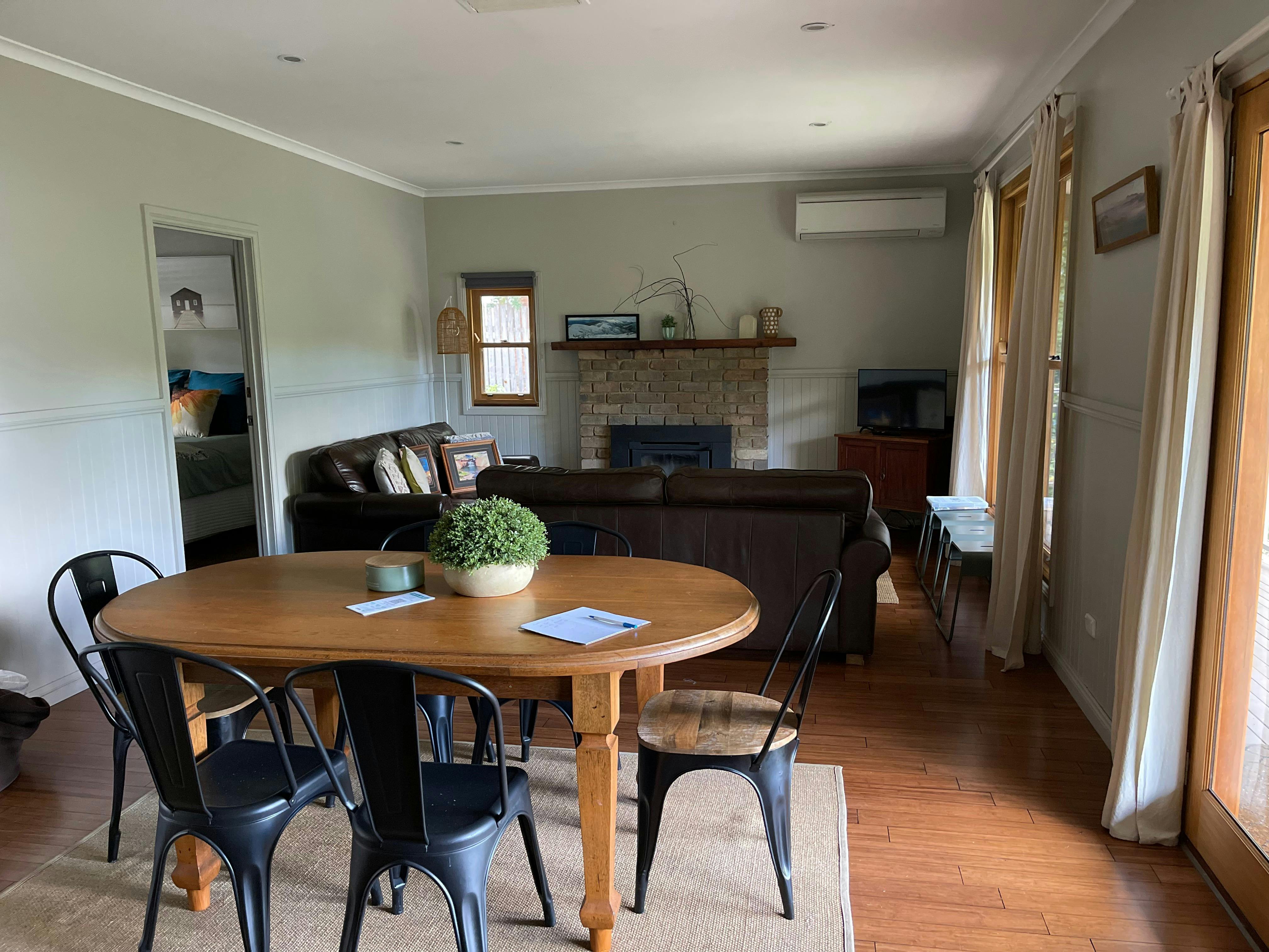 Open space dining with lounge in background