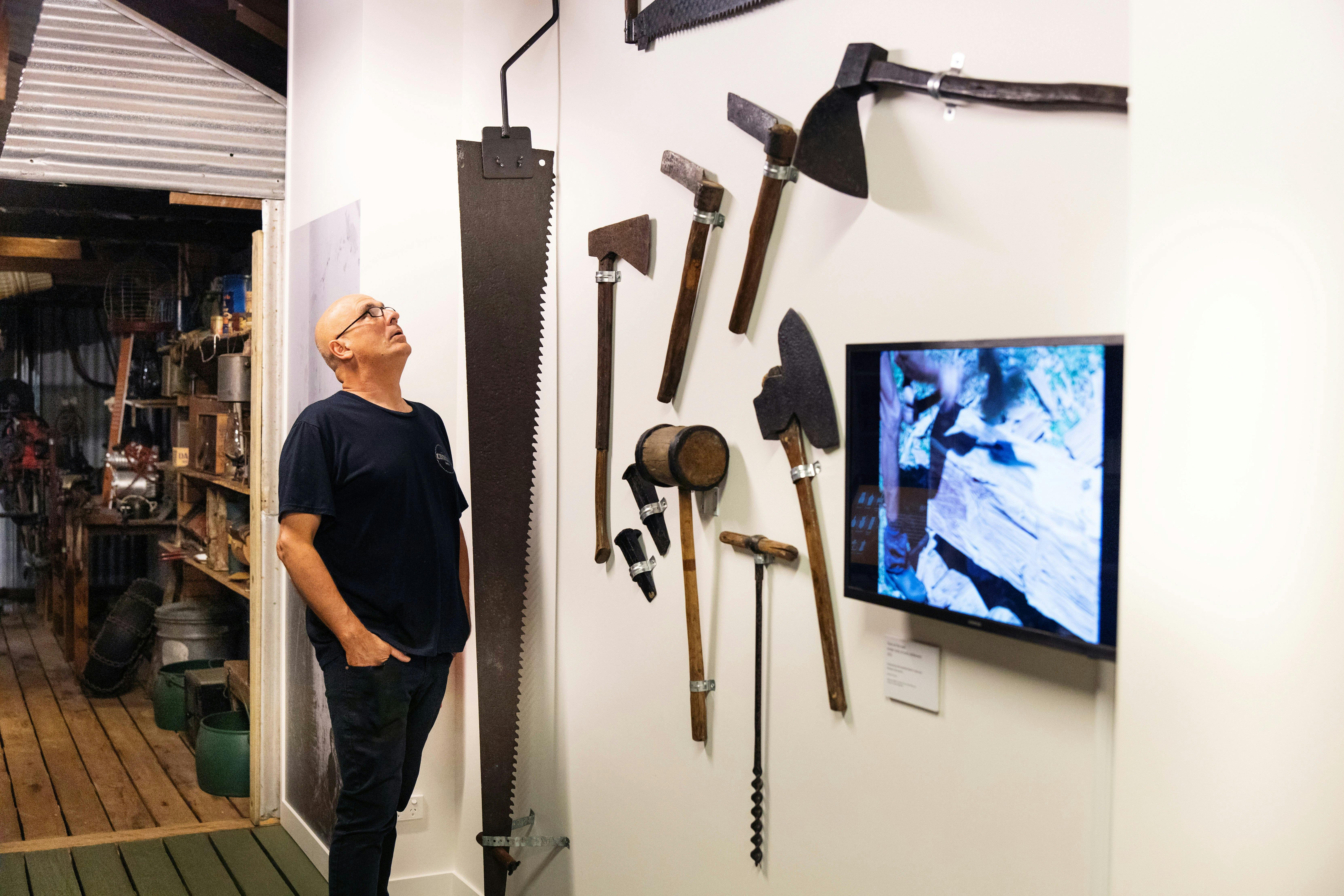 Man looking at a display as part of a The Shed exhibition