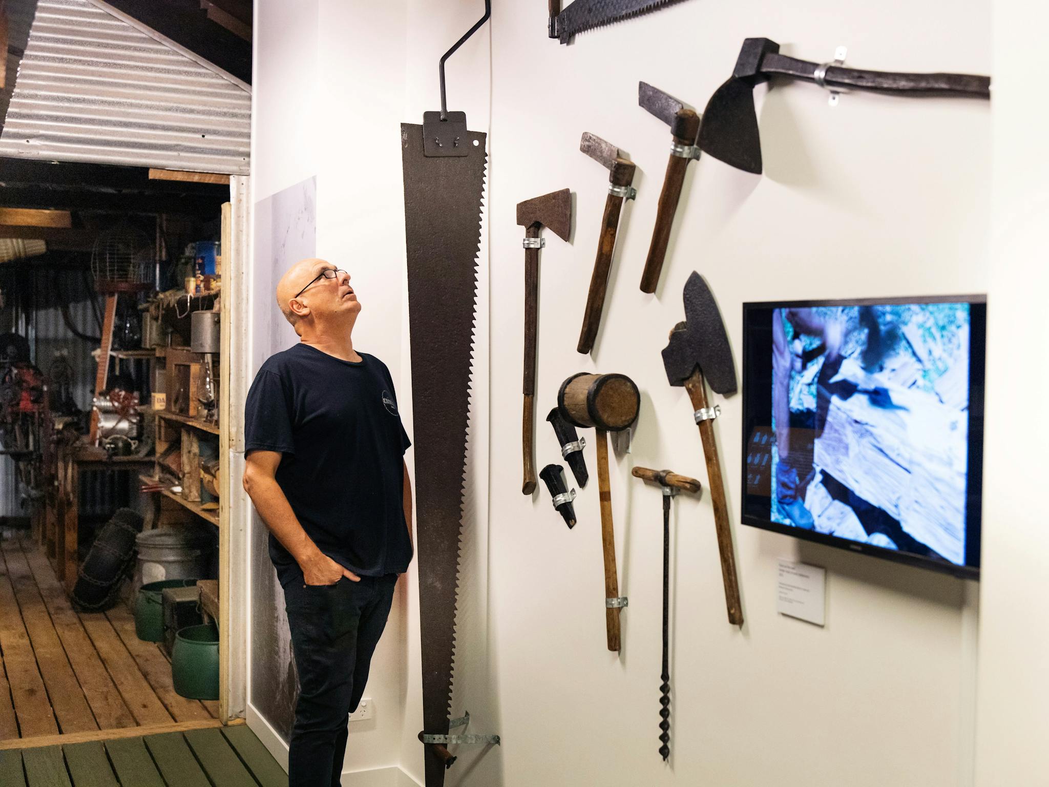 Man looking at a display as part of a The Shed exhibition