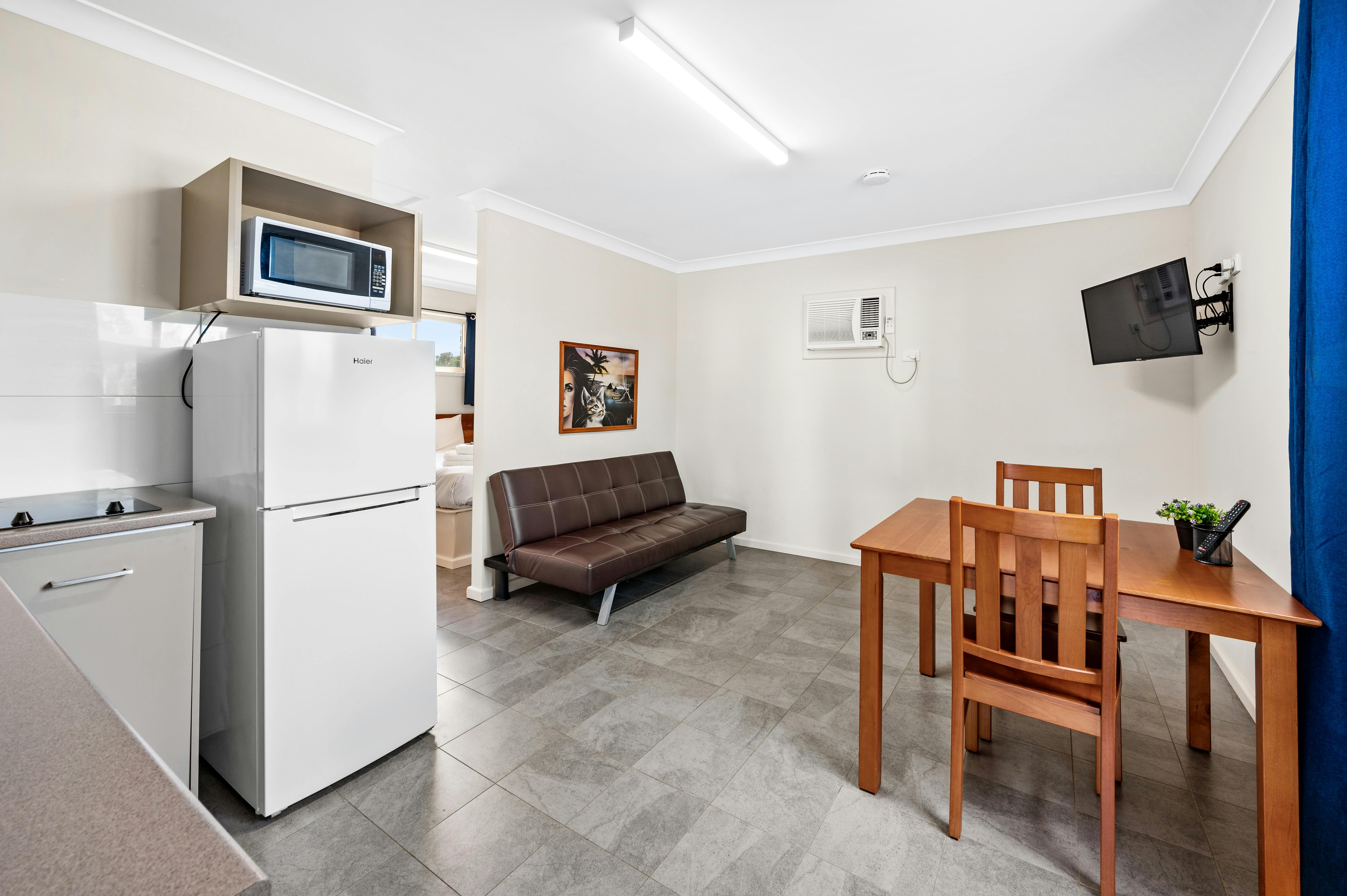 self contained 1-bedroom cabin queen double bed kitchen living dining ensuite bathroom air con