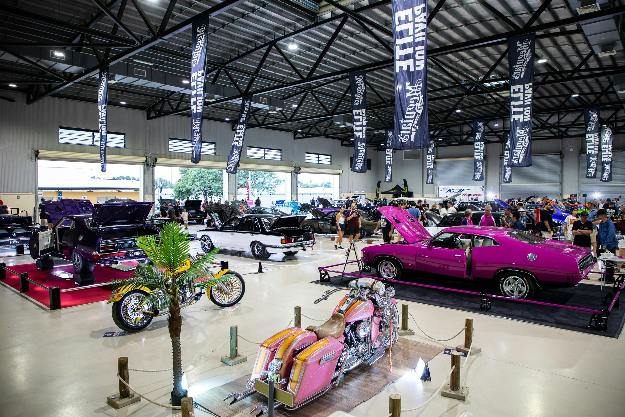 Show cars and motorcycles on display inside the Rockynats Elite Pavilion.