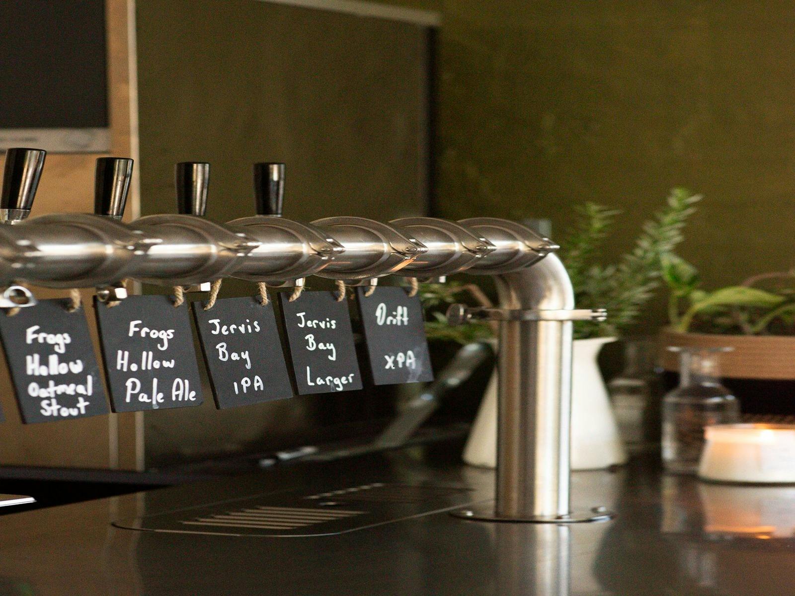 The photograph captures the inviting atmosphere of a contemporary brewery.