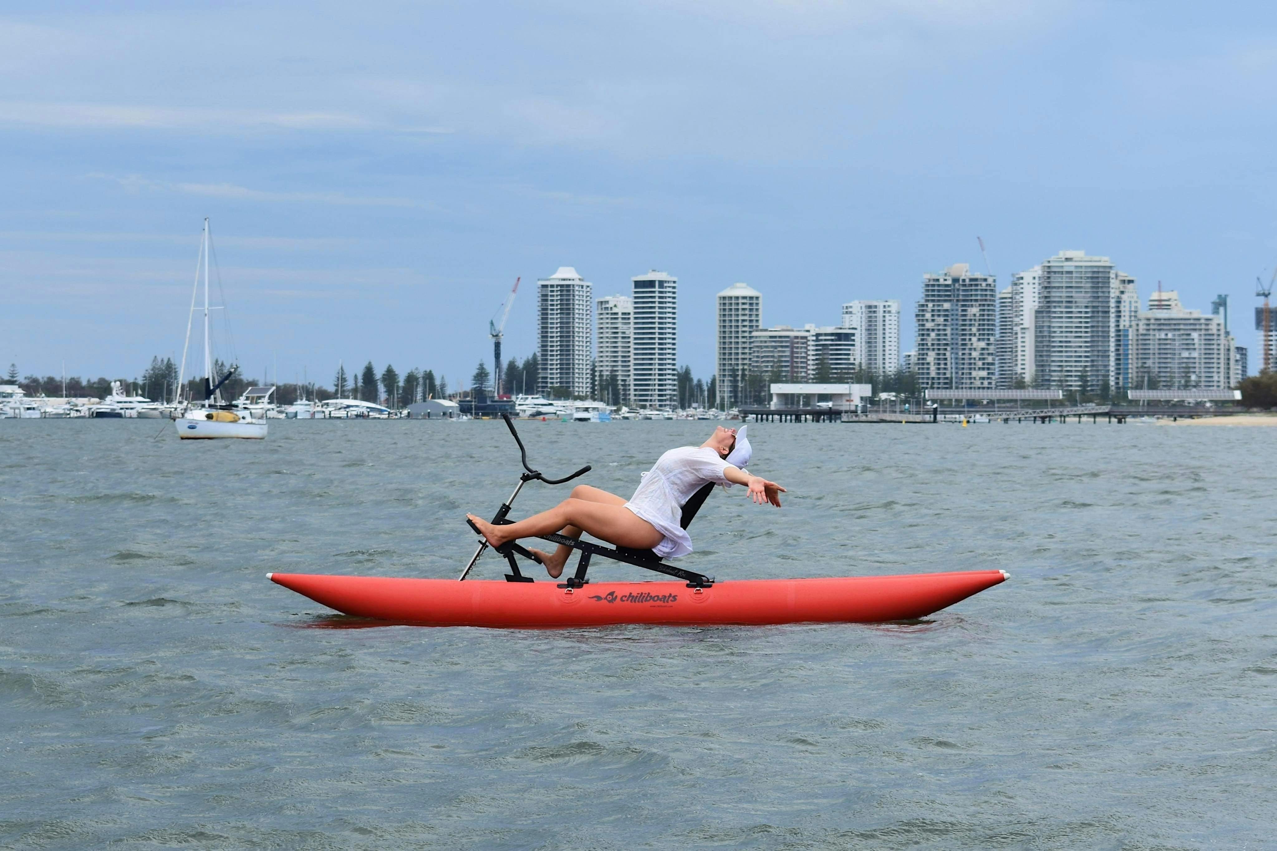 Woman reclining on waterbike.