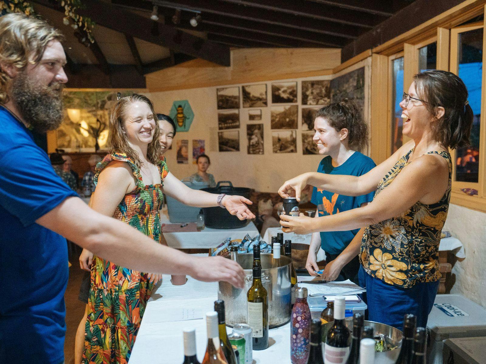 People serve drinks at bar at Dungog Shakespearience Theater Producation at Wangat Lodge venue, NSW