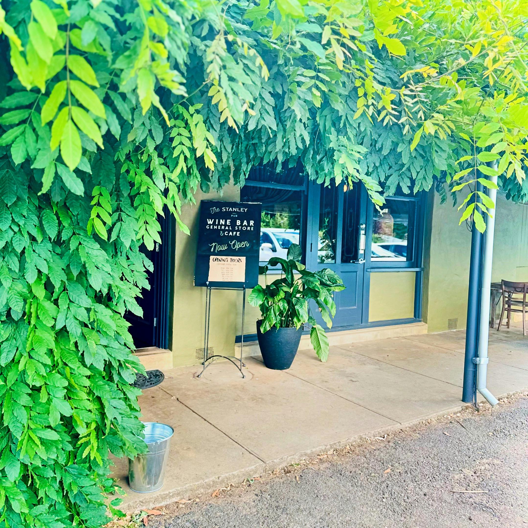front door to cafe with wisteria