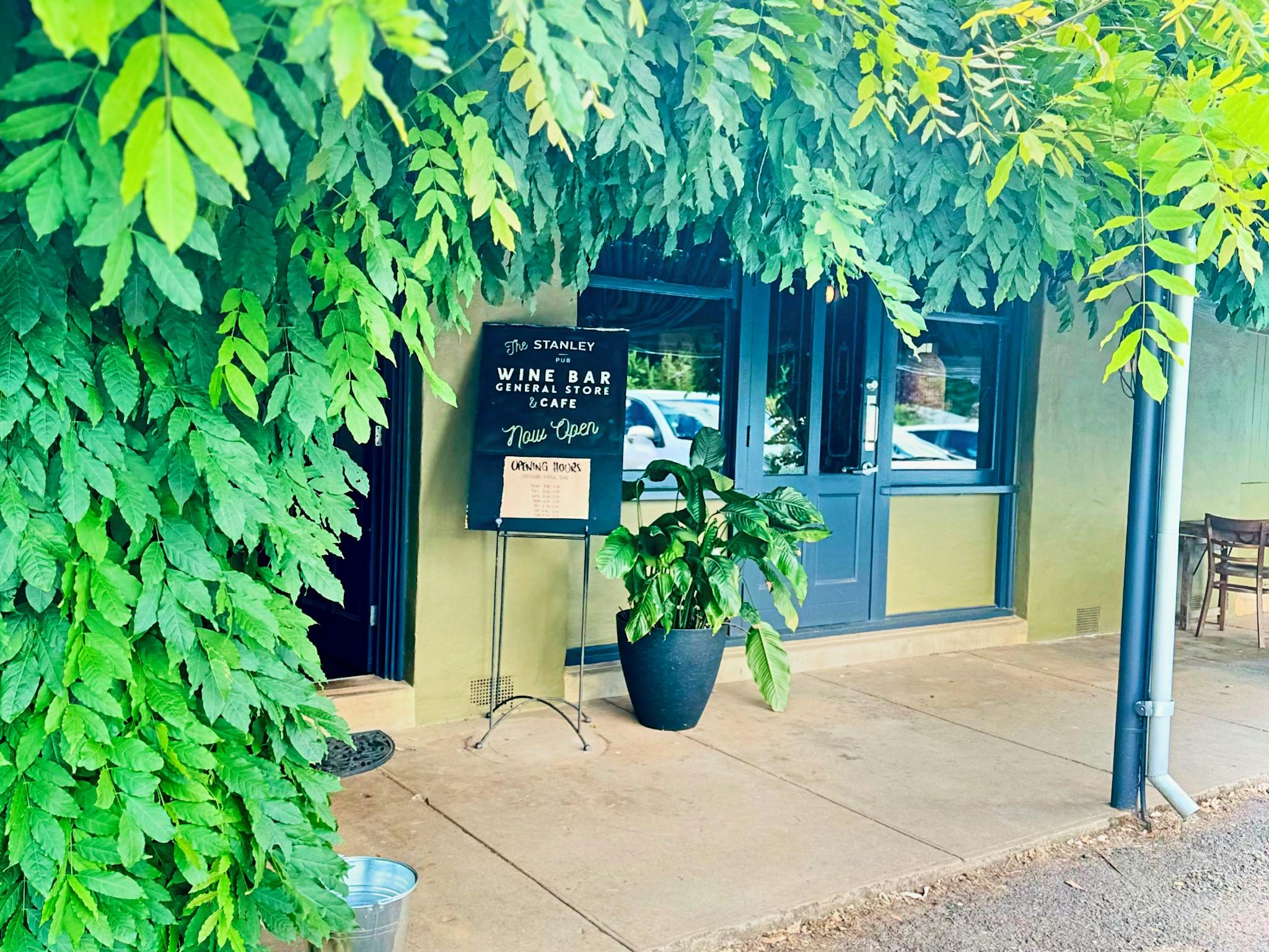 front door to cafe with wisteria