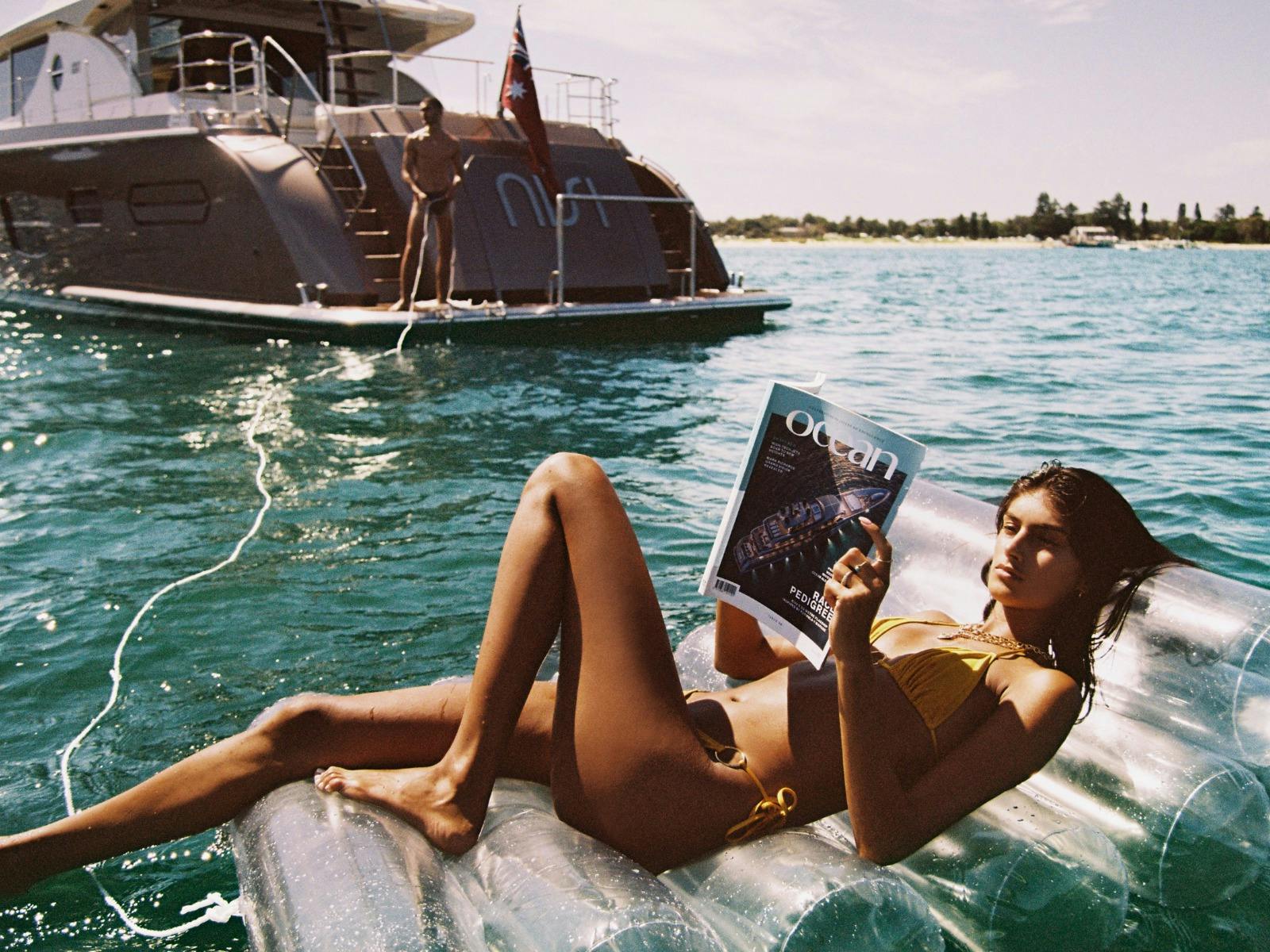 Nisi - girl on float toy in water