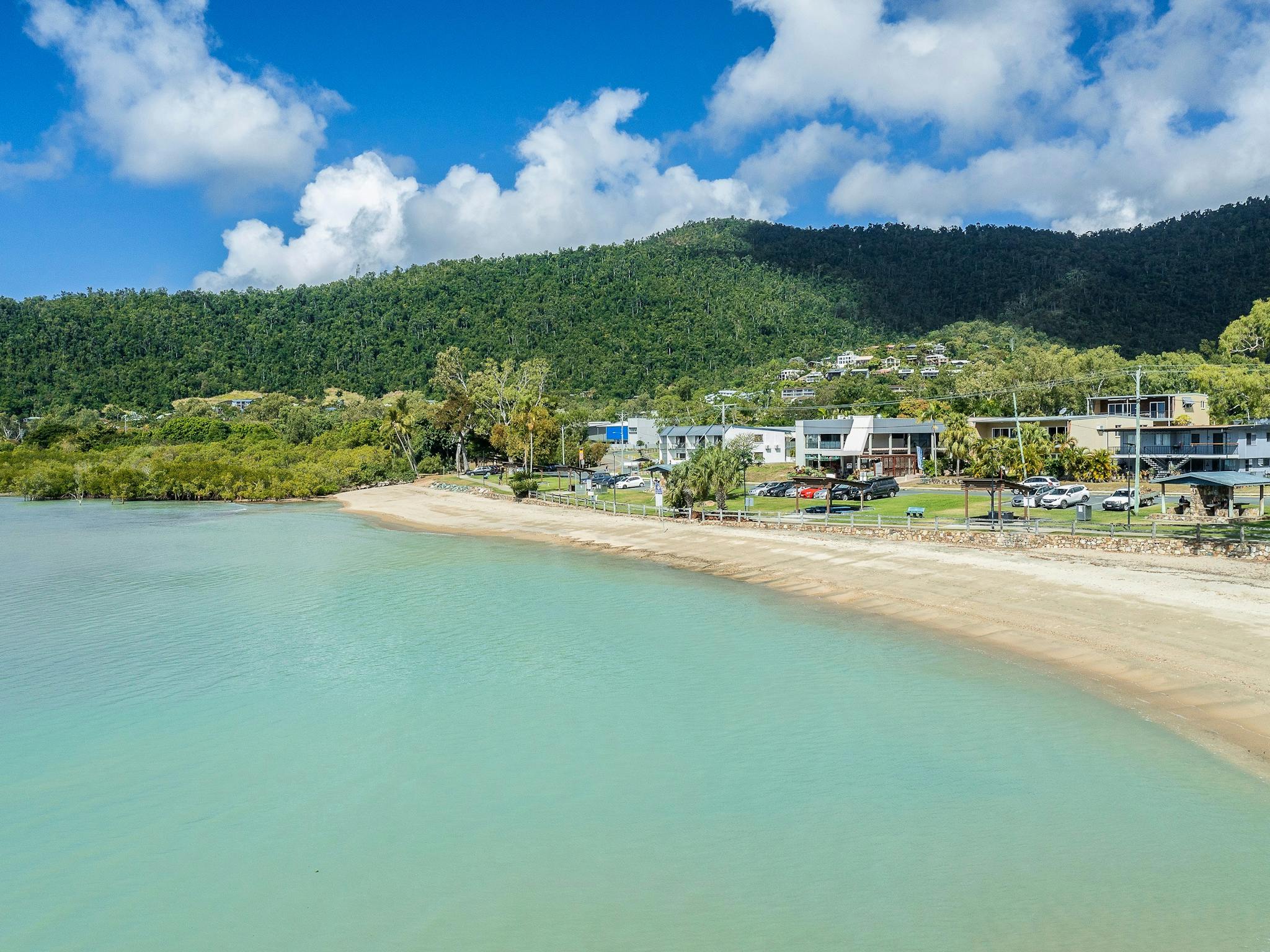 Aerial view of Cannonvale Beach with accessible outdoor gym, playground and picnic areas Aerial view of Cannonvale Beach with accessible outdoor gym, playground and picnic areas