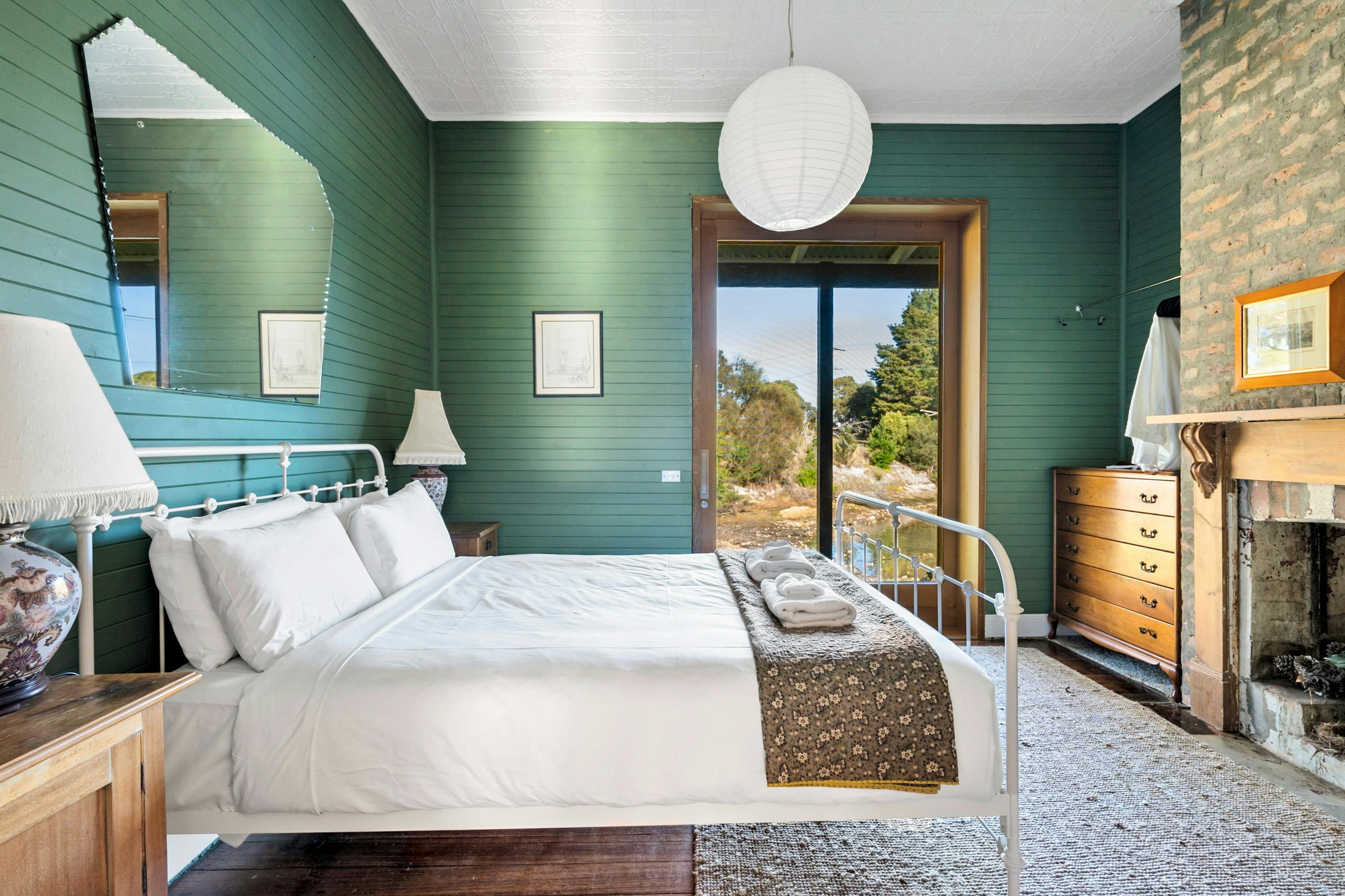 Queen sized bed overlooking Barnes Bay