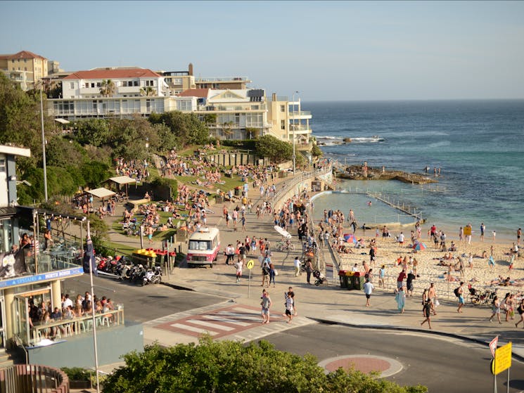 Another stop of Sydney bus tour at Bondi Beach. A lot of people on the sand sunbathing and relaxing.