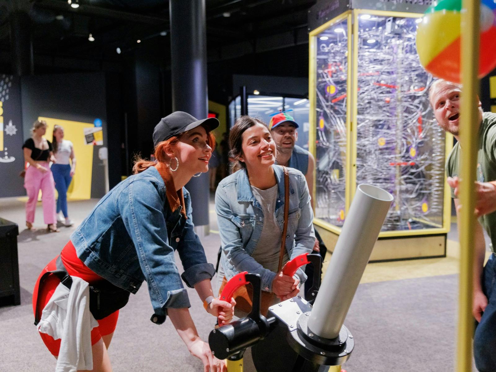 Adults using a Questacon exhibit