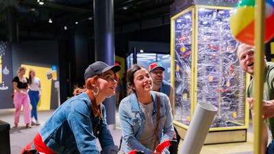 Adults using a Questacon exhibit