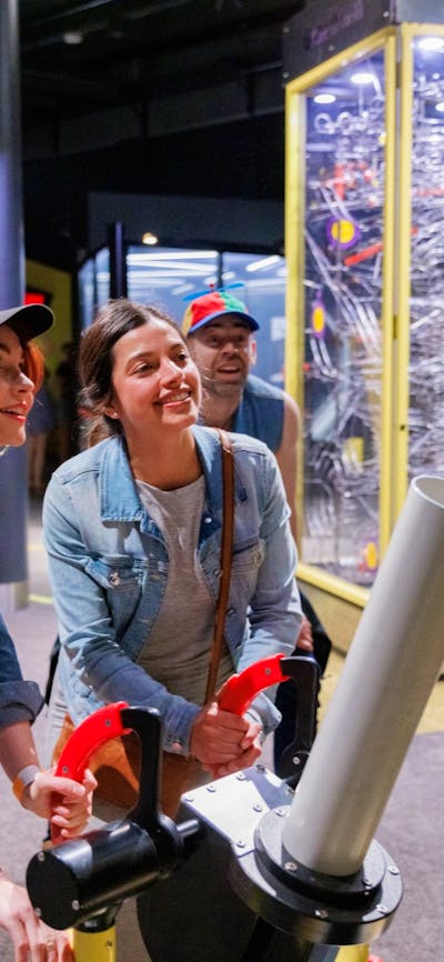Adults using a Questacon exhibit