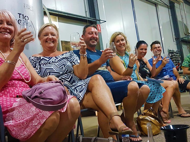 Group wine tasting in the wine maker's shed at Capercaillie Wines