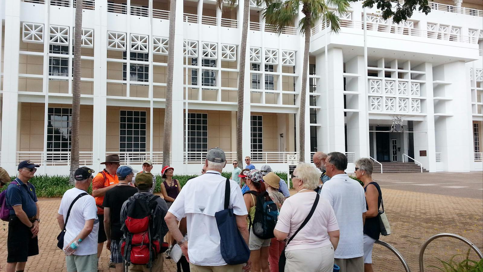 Group outside Parliament House Darwin hearing about the first bombing raid