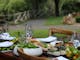 lunch set of salad, food and drink glasses on an outdoor table at Flowerdale Estate
