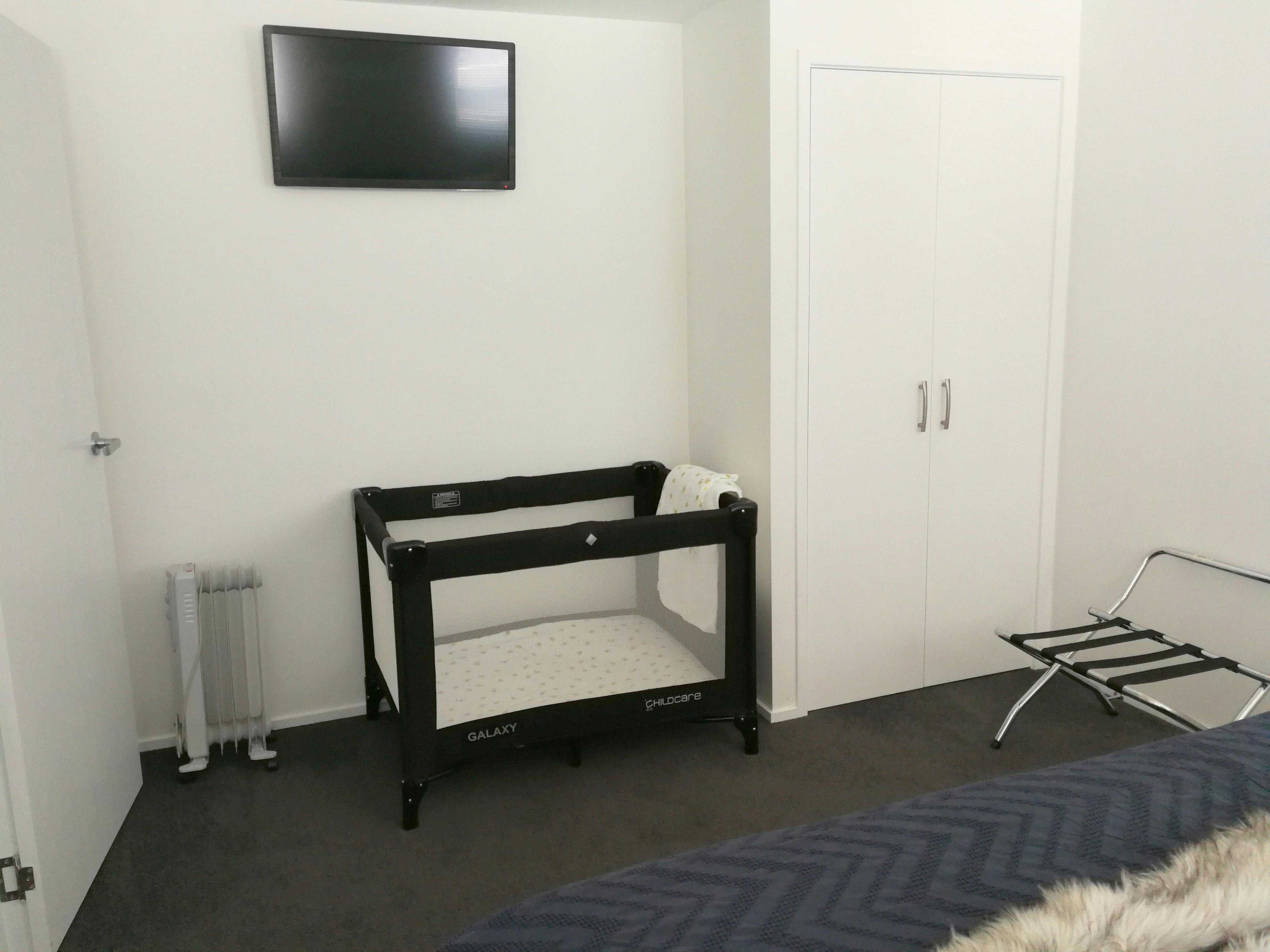 Port-a-cot set up in bedroom 2
