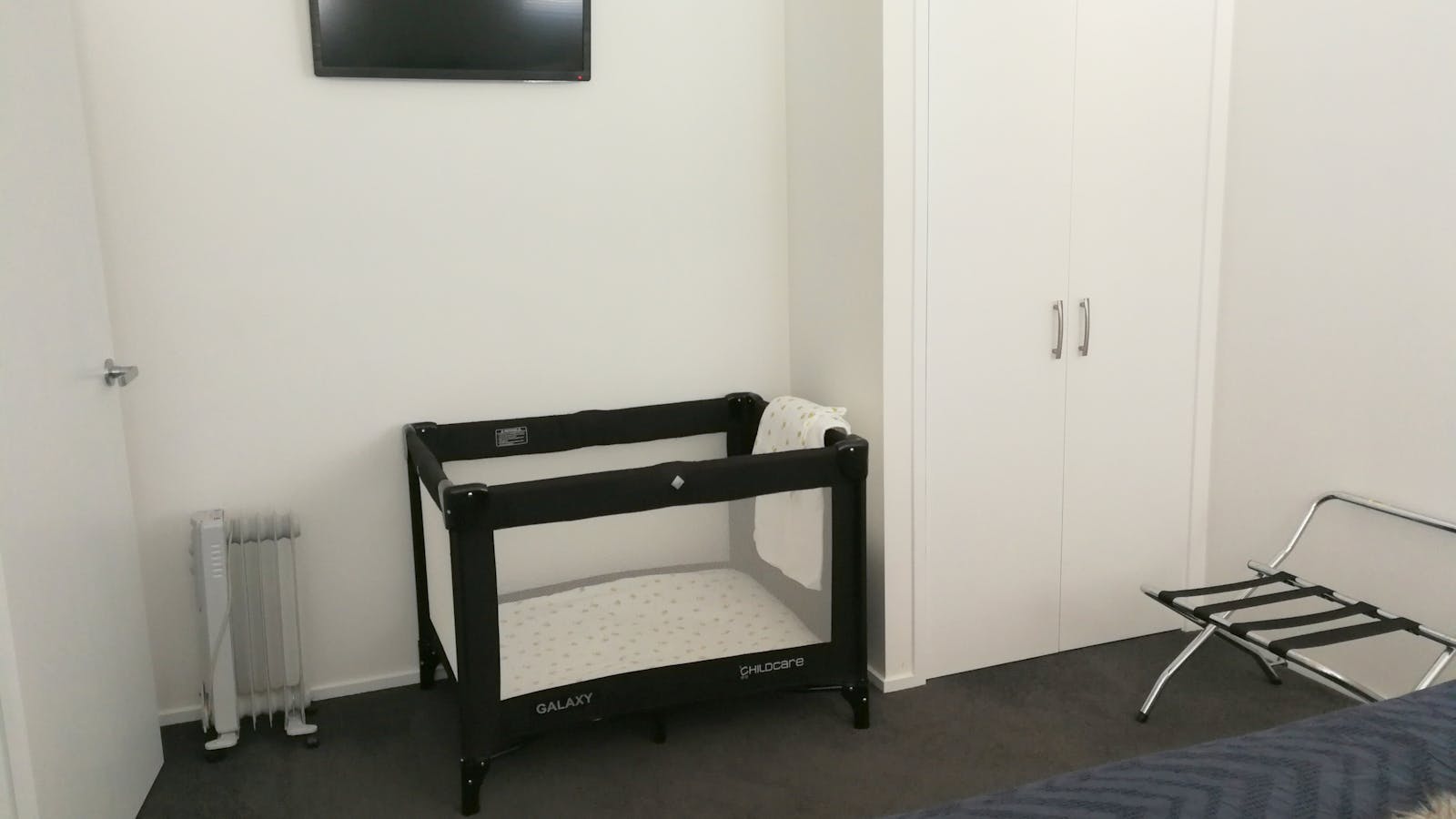 Port-a-cot set up in bedroom 2