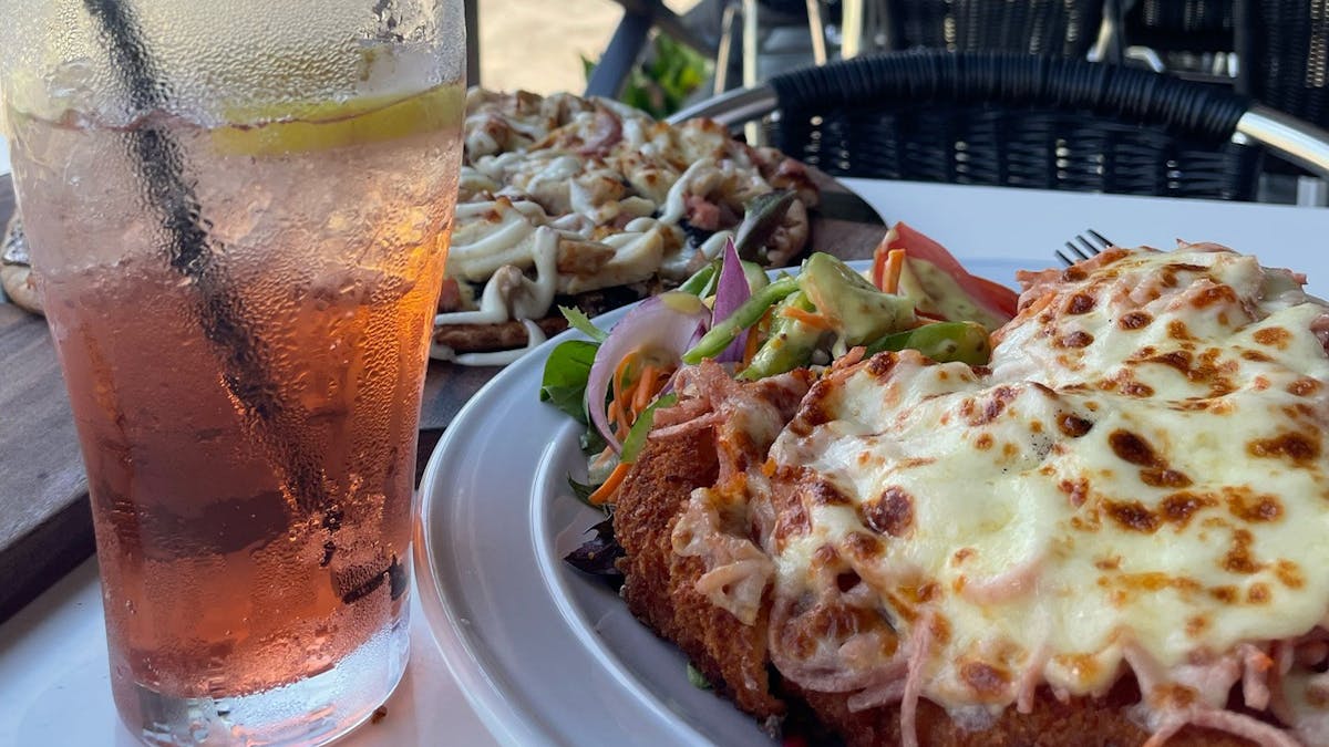 Chicken schnitzel, pizza and drink