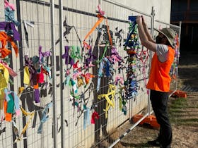 Community fence weaving activity as part of New Year's Even celebrations