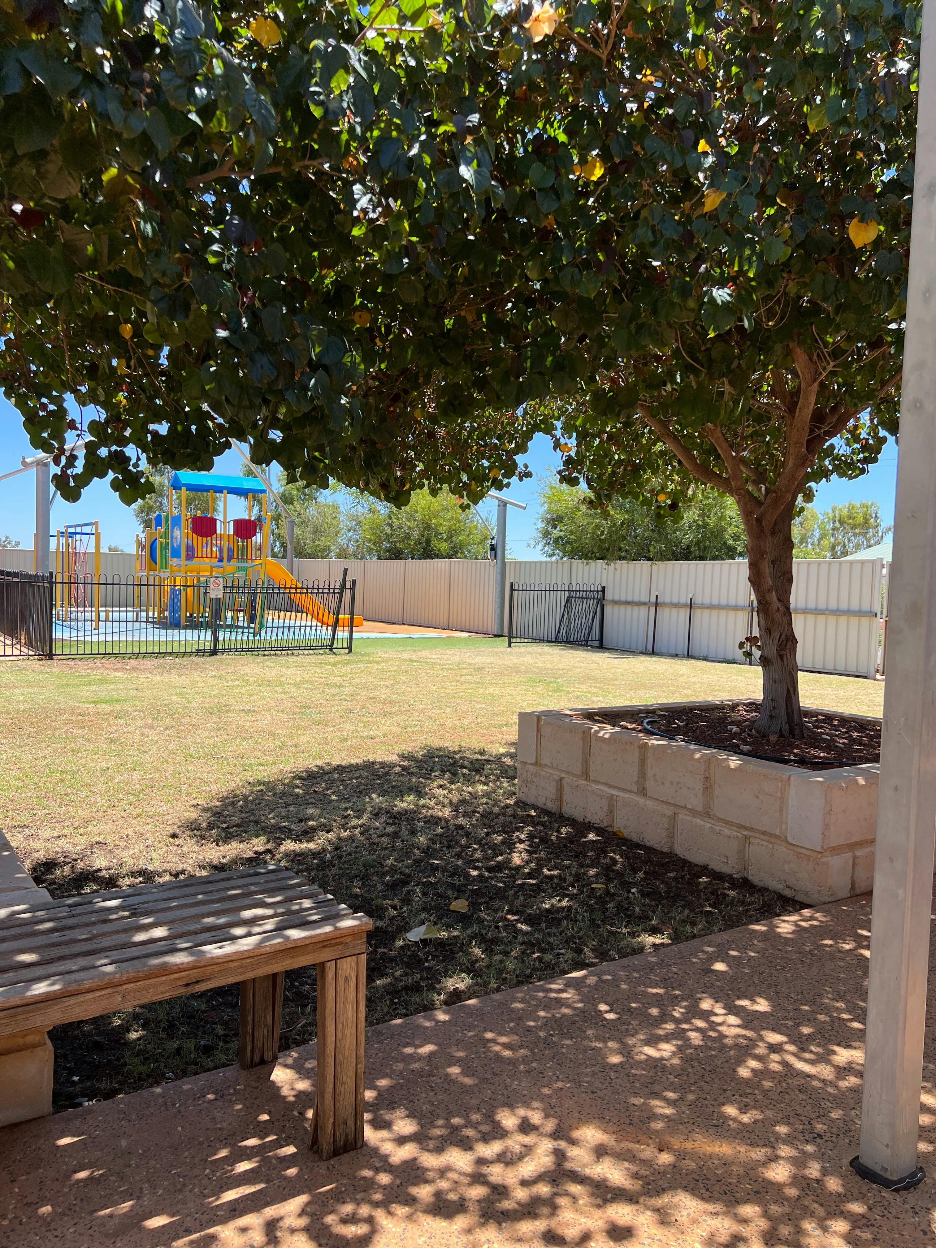 Childrens Playground outside with lawn area with shady trees at Gascoyne Junction Pub and Tourist Pa