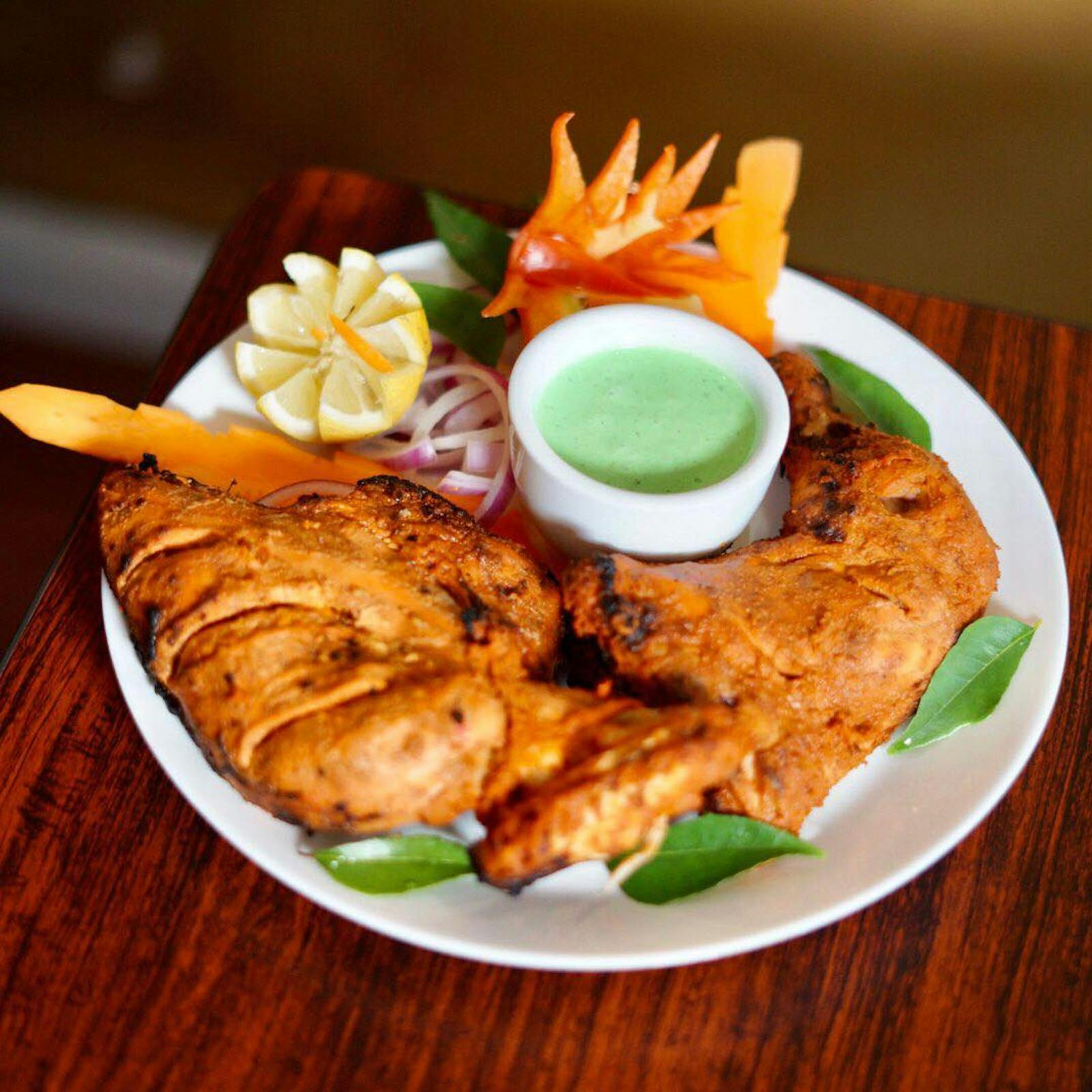 Tandoori Chicken at New India Restaurant, Adelaide, with smokey flavour, yoghurt and mint chutney.