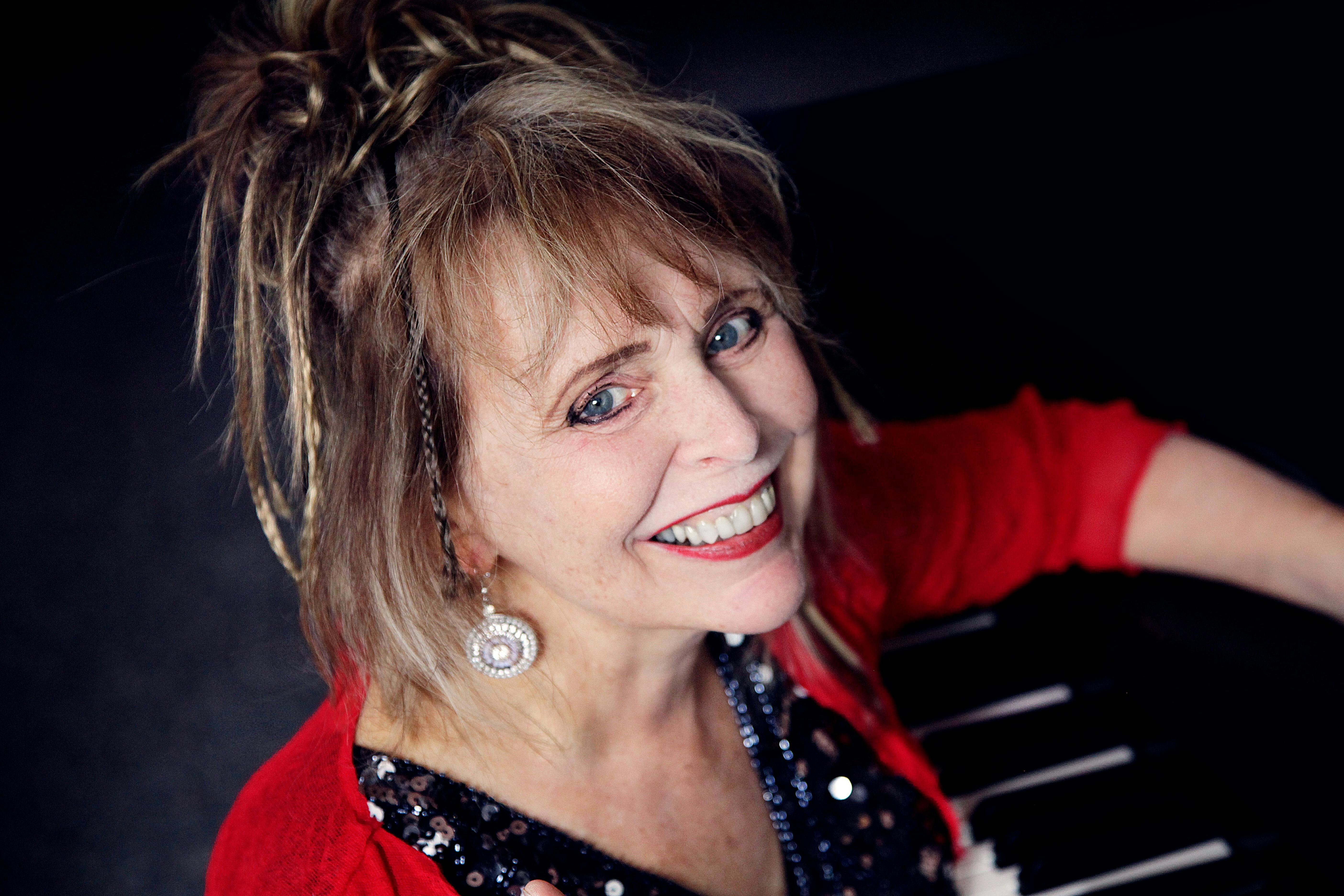 woman looking at camera and smiling