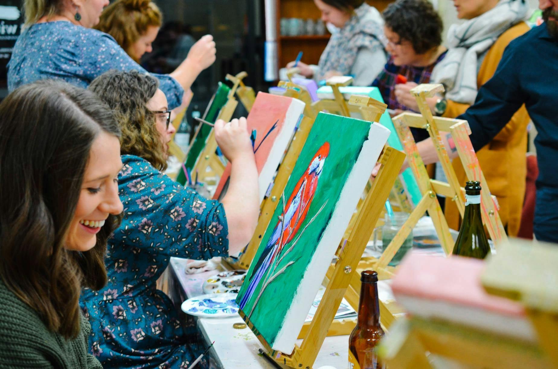 People painting birds
