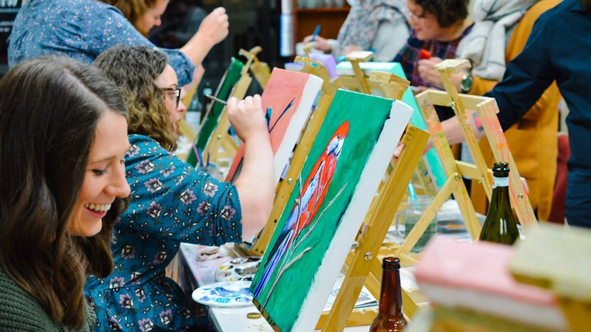 People painting birds